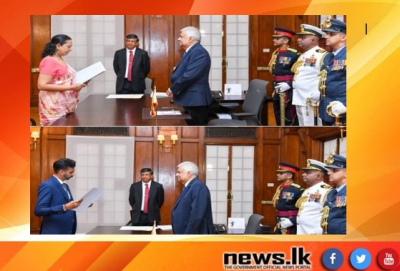 Two new Cabinet Ministers take oath before the President.