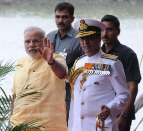 Prime Minister Narendra Mod,i with Chief of Naval staff Admiral R.K. Dhowan, arrivies for commissioning of INS Kolkata on Saturday.