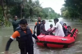 Navy teams rescue more flood victims