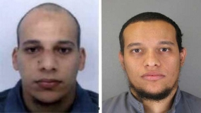 France hunts for 2 suspects; Nation mourns their victims