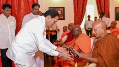 President hands 75 Temples title deeds of sacred premises