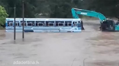 Bus carrying passengers swept away in floodwaters