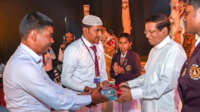 President presents ‘Polonnaruwa’, academic volume, to school children and public